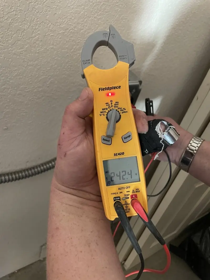Voltage testing with clamp meter during Generator Installation in Alamo Heights